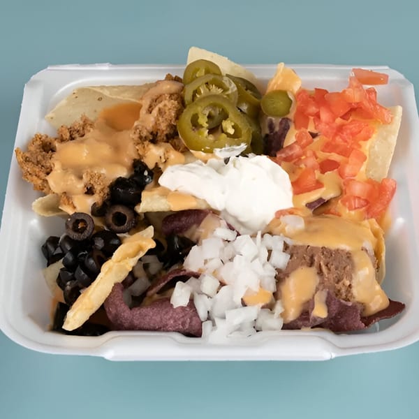 Pepe's Mexican Café nachos with cheese, ground beef, jalapeños, tomatoes, olives, onions, and sour cream.
